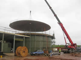 Insulated fibreglass roof being moved into position